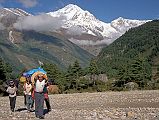 101 Crew Leaving Lete With Dhaualagiri Behind We left Lete at 7:40 and started our trek to Annapurna North Base Camp. Dhaulagiri shone in the early morning sun behind us.